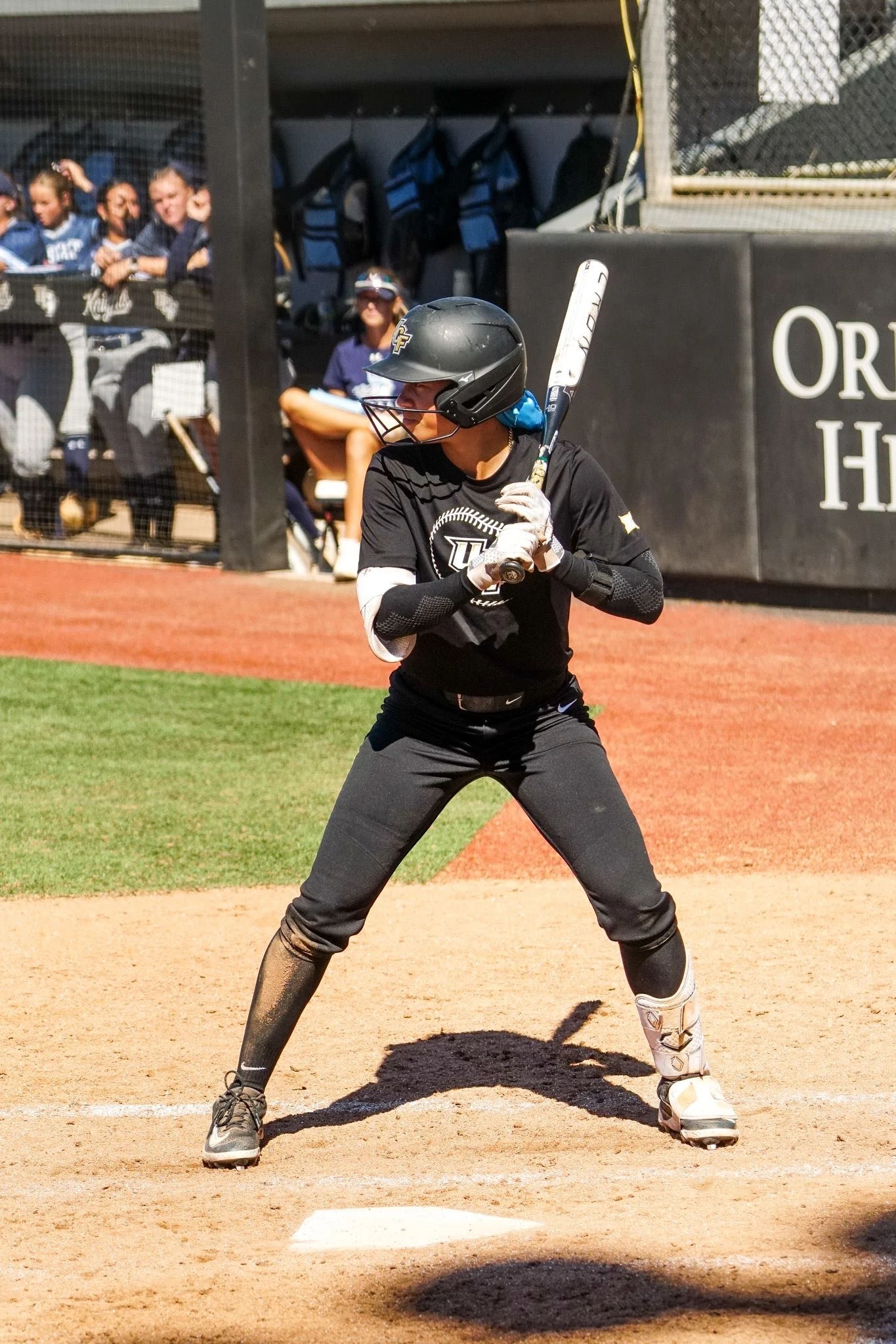 Zoe Calvez in her batting stance at the plate in a UCF home uniform
